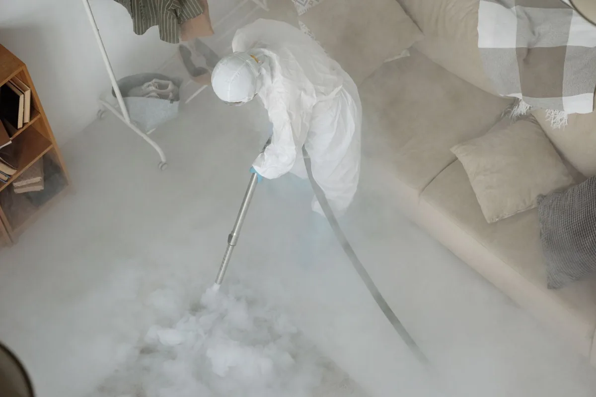 Biohazard cleanup technician in protective equipment, Crosslake, MN